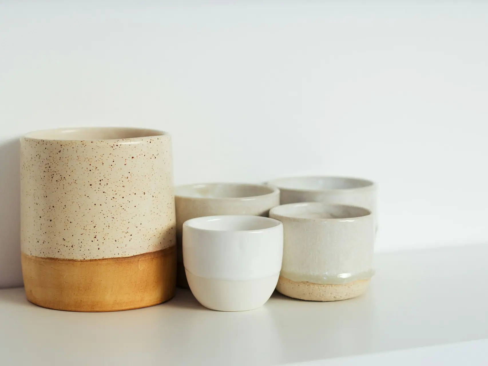 white and brown ceramic bowls